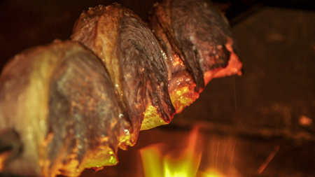 Meat picanha in fire Brazilの写真素材