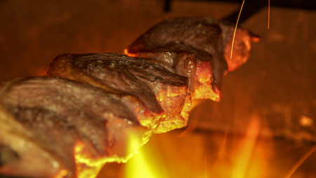 Meat picanha in fire Brazilの写真素材