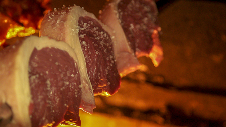 Meat picanha in fire Brazilの写真素材