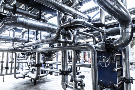 Industrial steam pipe with valves and stainless steel actuatorsの写真素材