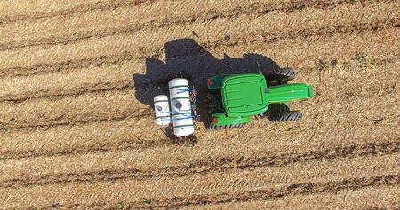 Sugarcane planting by applying fertilizer and insecticides with tractorの写真素材