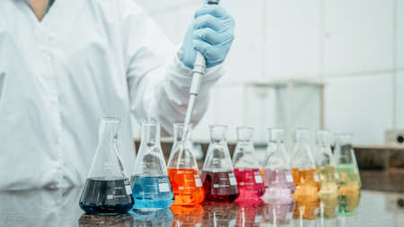 Laboratory test beaker with colored liquidsの写真素材