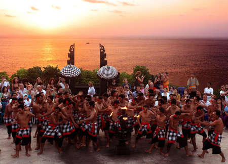Historic Kecak & Fire dance performed at the top of magnificent cliff in Uluwatu area, Bali, Indonesia.のeditorial素材