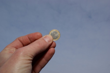 Holding a coin, euro, handの写真素材
