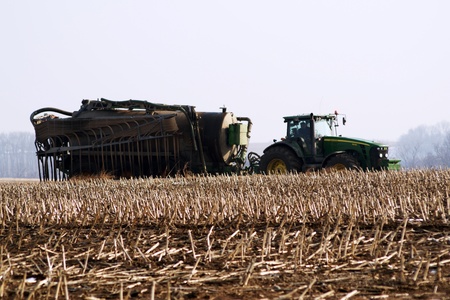Farmer spreading manure