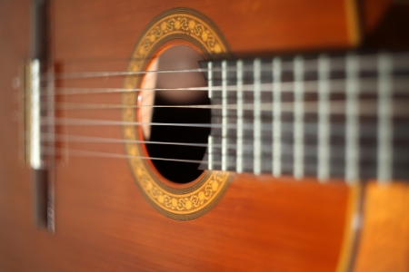 Close on the strings on a classical wooden guitarの写真素材
