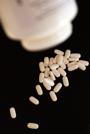 White pills out of boxの写真素材