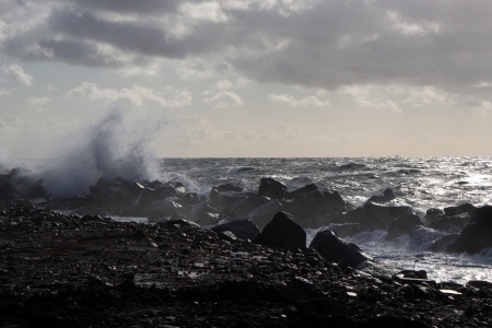Waves spraying at the coastの写真素材