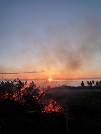 Bonfire and sunset over waters. Denmarkの写真素材
