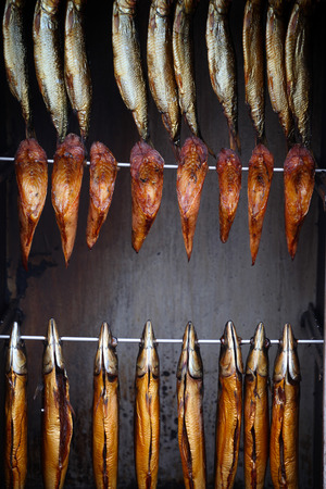 Smoked fish steaks on spits.の写真素材