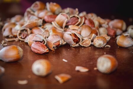 Fresh hazelnuts on a wooden tableの写真素材