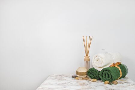Spa objects and elements on a marble table and white backgroundの写真素材