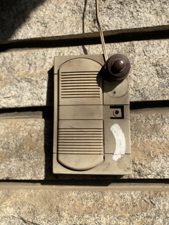 Vintage doorbell on a stone wall, closeup of photoの写真素材