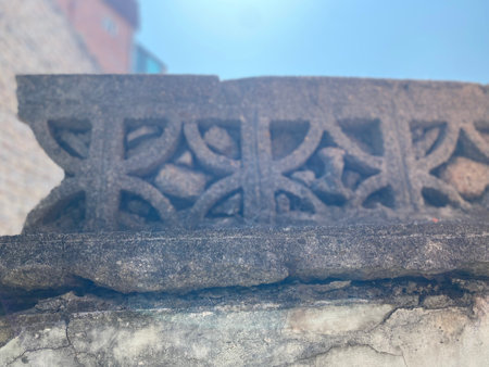Stone carved in the wall of an old house in the city.の写真素材