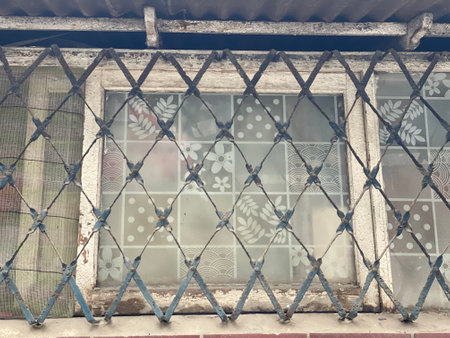Old window with lattice. Filtered image processed vintage effect.