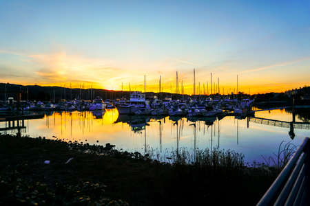 Sunset at the marina with boats and yachts.の写真素材
