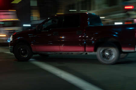 View of the car on the road at night. Blurred motion.