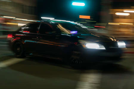 Car on the road at night with motion blur. Blurred background.