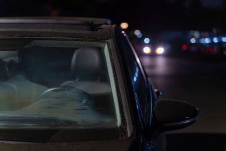 Car windscreen in the city at night. Close-up.の写真素材