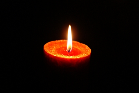 Candle light in the darkの写真素材