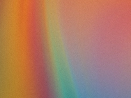 A gradient of vibrant colors blending seamlessly into a soft pastel finish on textured surface