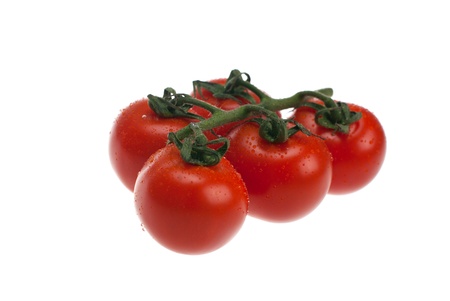 Fresh tomatoes shot on a white background.の写真素材