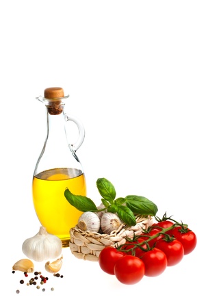 Olive oil, garlic, tomatoes, shot on a white background.の写真素材