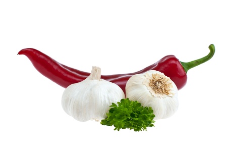 Pepper, garlic, parsley shot on a white background.の写真素材