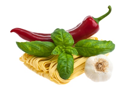 Pasta, pepper, basil, garlic, shot on a white background.の写真素材