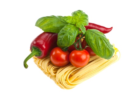 Pasta, peppers, tomatoes, shot on a white background.の写真素材