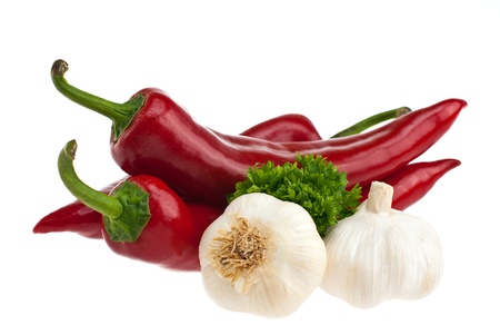 Peppers, garlic, parsley shot on a white background.の写真素材