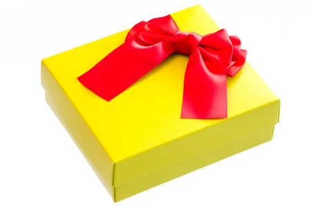 Gift box with a red  ribbon bow isolated on white background の写真素材