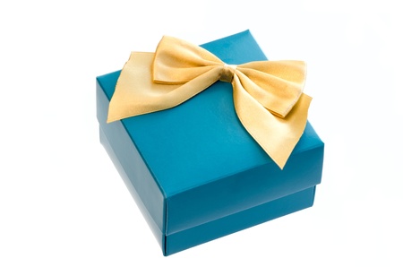 Gift box with a gold ribbon bow isolated on white background の写真素材