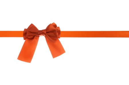 Holiday concept red ribbon bow isolated on white background の写真素材