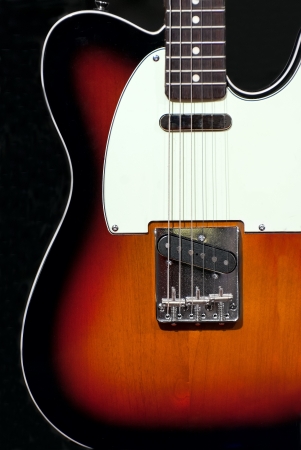 Musical concept electric guitar on a black background.の写真素材