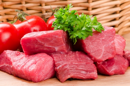 fresh raw meat on wooden boardの写真素材