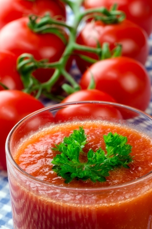 Fresh tomato juice with herbsの写真素材