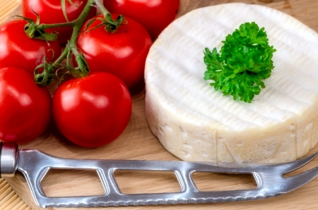 French soft cheese on wooden board.の写真素材