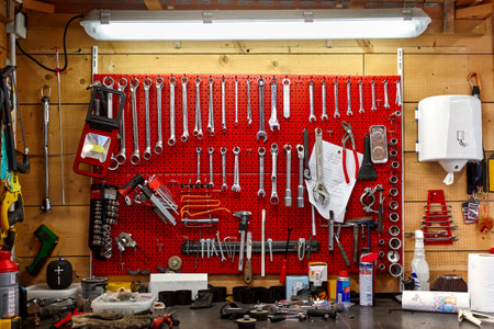 Pleurait, France - 11 22 2022: Work space of a mechanic and handyman with many utensils and toolsのeditorial素材