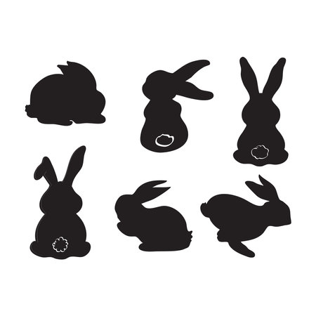 A set of elegant black bunny silhouettes in various poses, perfect for Easter, wildlife, or decorative designs. Ideal for digital prints, eater, and festive projects.のイラスト素材