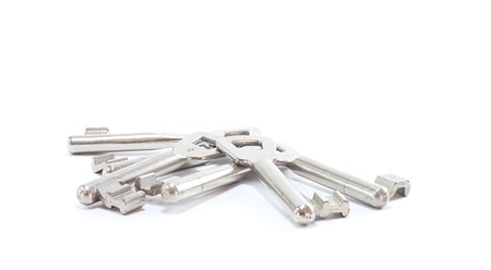 many room keys isolated on white backgroundの写真素材