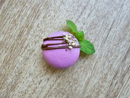 Macaroon with chocolate and mint on a wooden background. Top view.の写真素材