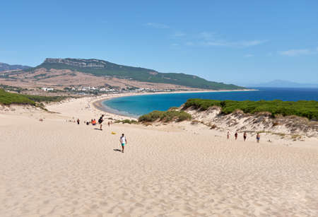 Landscape beachscape from dunes of playa de bolonia, august 2020. People enjoying summer, panoramic viewの写真素材