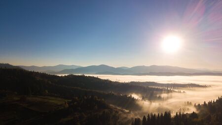 Majestic sunrise in the mountains landscape. Carpathian mountins with blue sky panoramic wiew,...