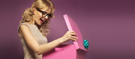 Panoramic picture of the woman with the gift boxの写真素材