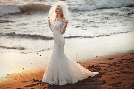 Lonely young bride looking for her husbandの写真素材