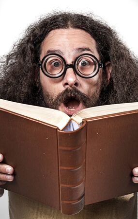 Cloesup portrait of an astonished, funny nerdの写真素材