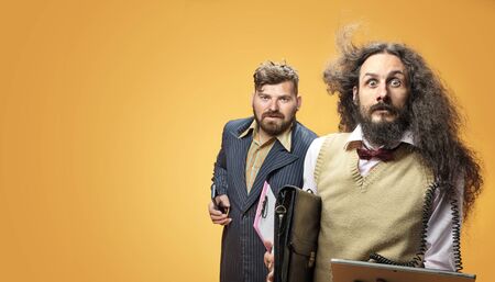 Funny portrait of a two nerdy businessmen 