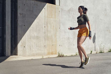 Portrait of a brunette, sensual woman doing the stretchingの写真素材