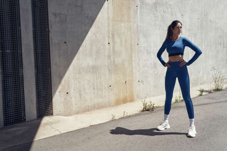 Attrative, young athlete taking a break during joggingの写真素材